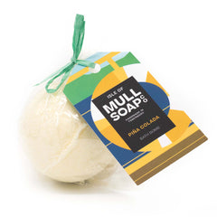 pale yellow coloured Pina colada round bath bomb presented as a gift in a bag with coloured tag and bow. Handmade by the Isle of Mull soap co in Tobermory, Scotland. 