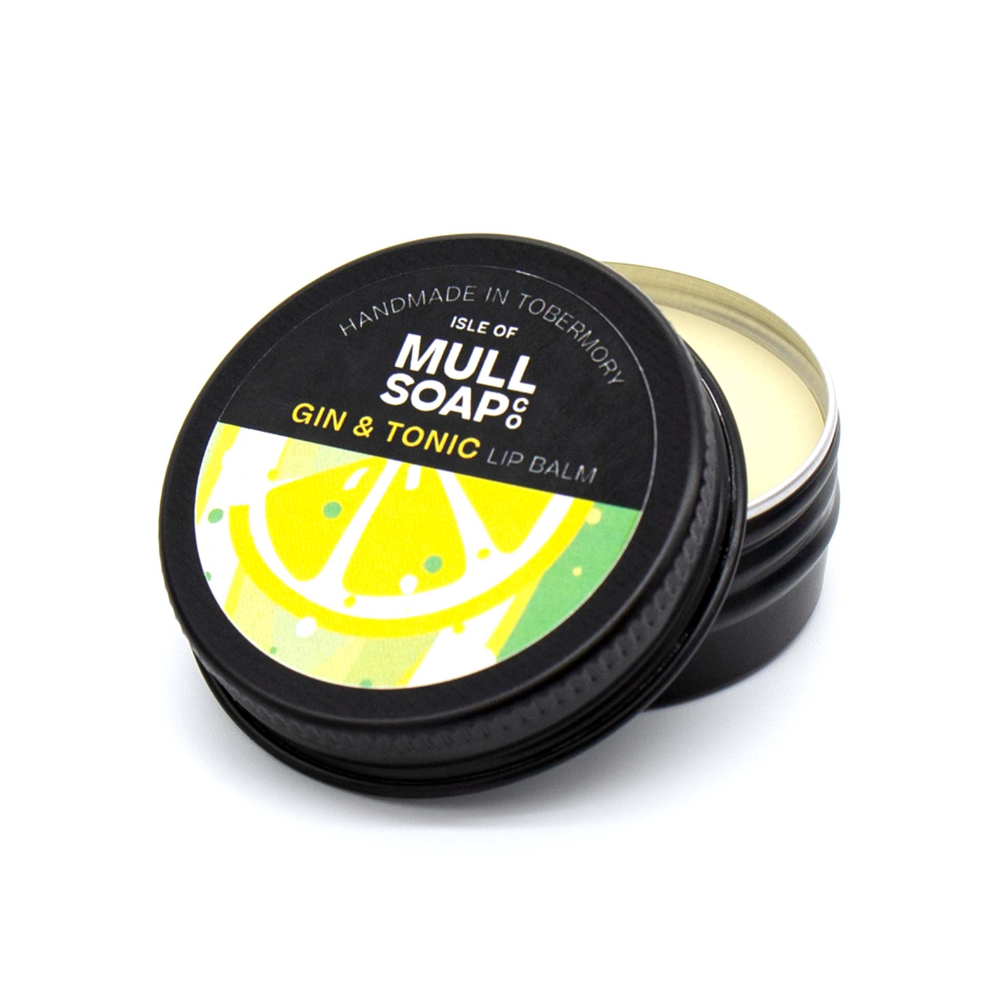 gina and tonic lip balm in a black tin with colourful label. vegan lip balm handmade in Tobermory by the Isle of Mull soap co. 