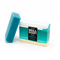 a rosemary and eucalyptus soap box sitting next to the green soap bar. The box is a sand and green coloured design. The soap is described as refreshing and invigorating. Handmade in Tobermory by the Isle of Mull soap co.  