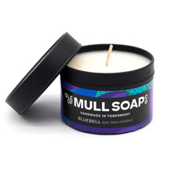 A black tin and lid with blue and purple floral label. bluebell soy wax candle handmade in Tobermory by the Isle of Mull Soap Co 