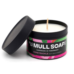 A black tin and lid with colourful pink floral label. honeysuckle soy candle handmade in Tobermory by the Isle of Mull Soap Co 