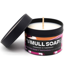 A black tin and lid with pink colourful label. Scottish rose and patchouli soy wax candle handmade in Tobermory by the Isle of Mull Soap Co 